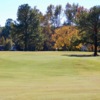A fall day view of a green at Wendell Country Club.