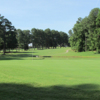 A sunny day view of a green at Wildwood Green Golf Club.