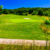 A sunny day view of a green at Salem Glen Country Club.