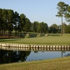 A view of green surrounded by water at Reedy Creek Golf Course