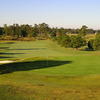 A view of green with bunker on the left and fairway in background at Lane Tree Golf Club