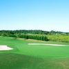 A view of green protected by sand traps at Pointe Golf Club