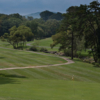 A view of a hole with undulating cart path in background at Crowne Plaza Tennis & Golf Resort