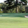 A view of a green guarded by a bunker at Chicora Country Club