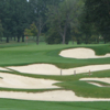 A view of a hole protected by a collection of tricky bunkers at Meadowbrook Country Club