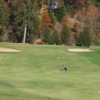 A view of a green flanked by sand traps at Asheville Golf Course