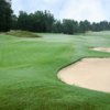 View of a green and bunkers at Riverwood Golf Club