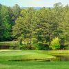 A view of a hole with water and sand traps coming into play at Foxfire Resort & Golf Club