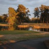 A view of a green surrounded by water at Land-O-Lakes Golf Club
