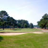 A sunny day view of a hole at Benvenue Country Club