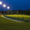 An evening view of the driving range tees at Knight's Play Golf Center