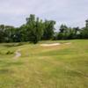 A view from a fairway with a narrow cart path on the left side at Sound of Freedom Golf Course
