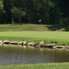 A view of a green with water coming into play at Lake Winds Golf Course