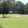 A view of a green protected by bunkers at Twin Oaks Golf Club