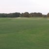 View of a green and bunkers at Meadowlands Golf Course