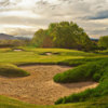 A view of a green protected by tricky bunkers at Connestee Falls Golf Course