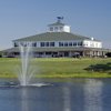 A view of the clubhouse and putting green at Little River Golf & Resort