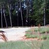 A view of hole #10 with bunker in foreground at Lonnie Poole Golf Course - North Carolina State University