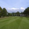 A view of hole #9 with clubhouse in right background at Sandpiper Bay Golf & Country Club - Piper Nine
