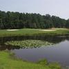 A view of green #11 protected by bunkers at River Course from Country Club of Whispering Pines