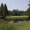 A view of the 14th green surrounded by water at River Course from Country Club of Whispering Pines