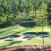 A sunny day view of a green from The Golf Club at Chapel Ridge.