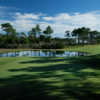 A view of a green guarded by a pond at North Shore Country Club.
